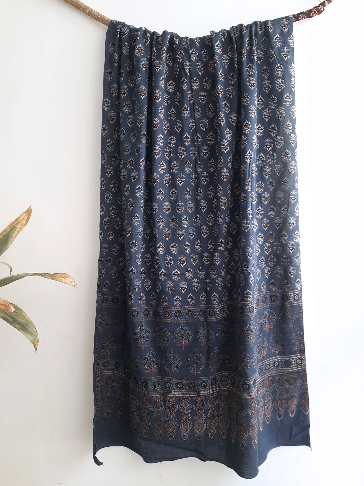 Close-up view of the Indigo Boota Ajrakh Cotton Dupatta, showcasing intricate hand block printing with authentic ajrakh techniques on 100% cotton fabric. A versatile and enduring accessory for a stylish summer look.