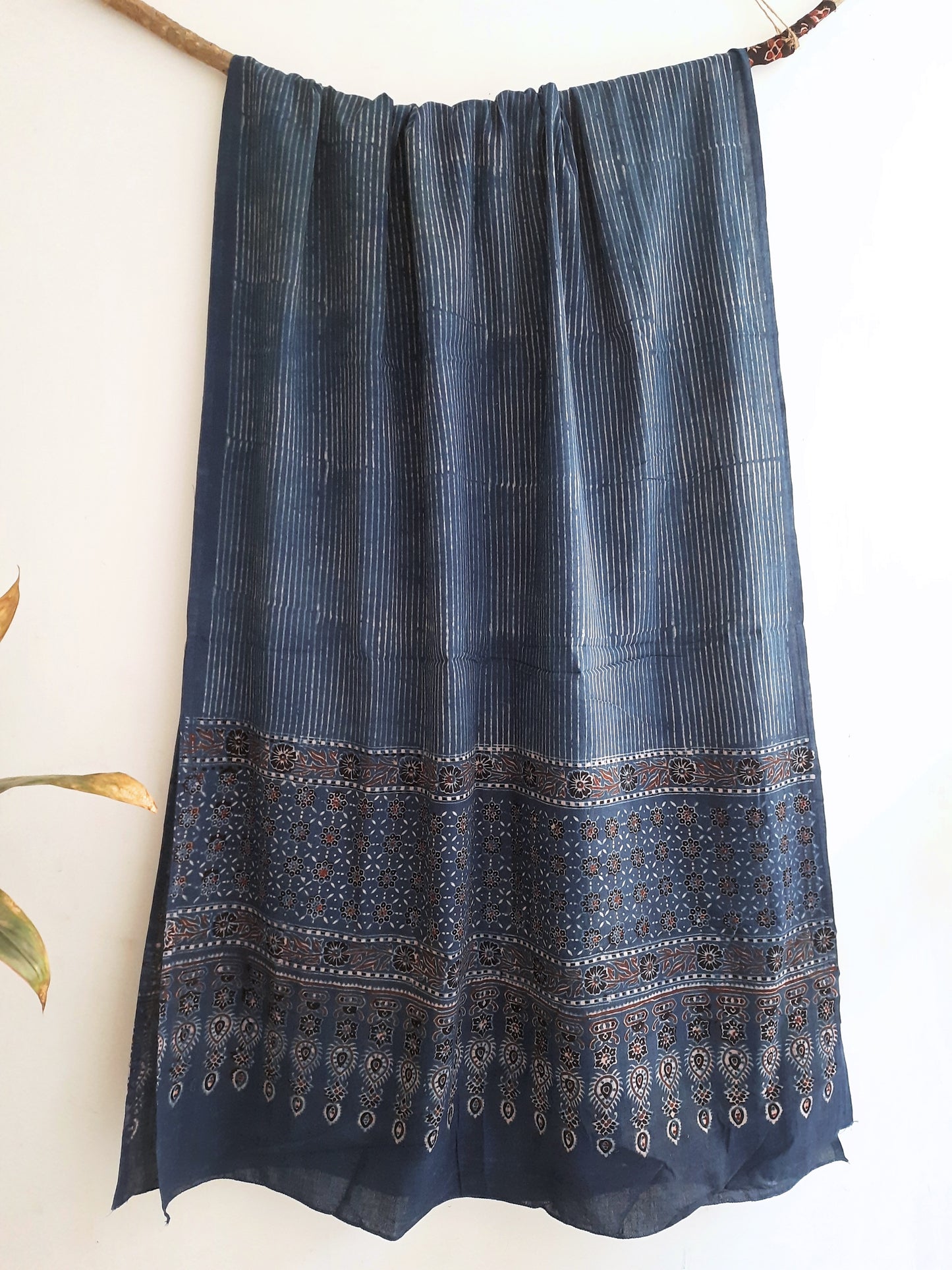 "Indigo Dyed Stripes Cotton Dupatta - Handcrafted using traditional ajrakh techniques, this sustainable and timeless piece adds artisanal charm to any outfit. A unique summer wardrobe update for eco-conscious fashion enthusiasts."