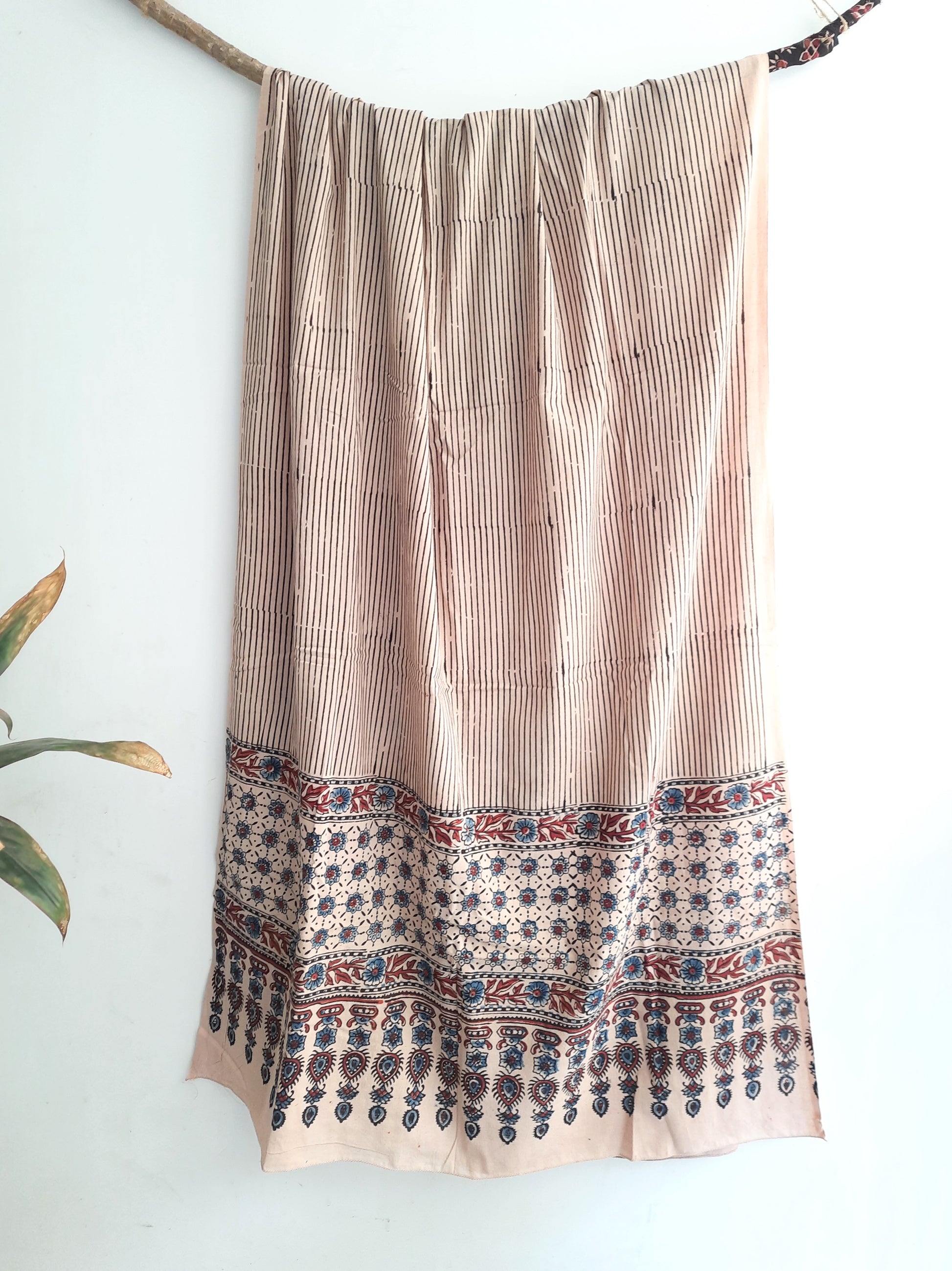 Turquoisethestore's Beige Stripes Ajrakh Cotton Dupatta, handcrafted with 100% pure cotton using traditional ajrakh methods and myrobalan dyed. Elevate your summer fashion with this eco-friendly, artisanal accessory, adding a timeless touch to any ensemble.