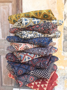 Ajrakh hand block printed fabric yardage, crafted using natural dyes. Ethically made, eco-friendly textiles featuring intricate patterns and rich hues. Perfect for sustainable fashion and home decor.