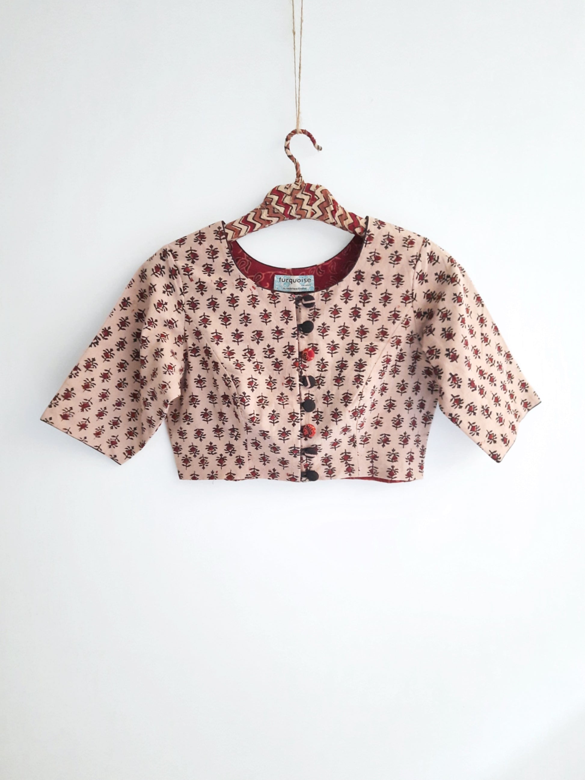 Ajrakh Blouse - a beige blouse featuring intricate Ajrakh hand block prints crafted in pure cotton with natural dyes.