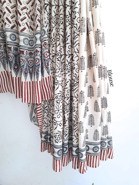 Off White Ajrakh Cotton Saree by Turquoisethestore, showcasing intricate hand block prints, crafted with natural dyes and sustainable methods.