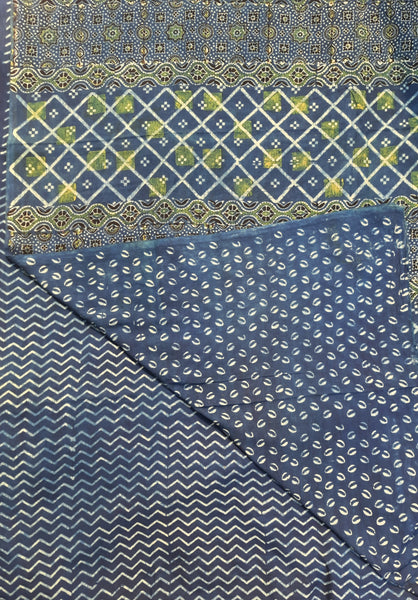 Indigo Ajrakh hand block printed saree in pure cotton, crafted with natural dyes. Elegant 6.3-meter saree with traditional patterns and a running blouse.