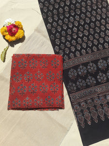 Handcrafted Ajrakh suit set in pure cotton, featuring intricate hand block prints and natural madder dye. Paired with a black dupatta, slow-made, breathable, and eco-friendly.