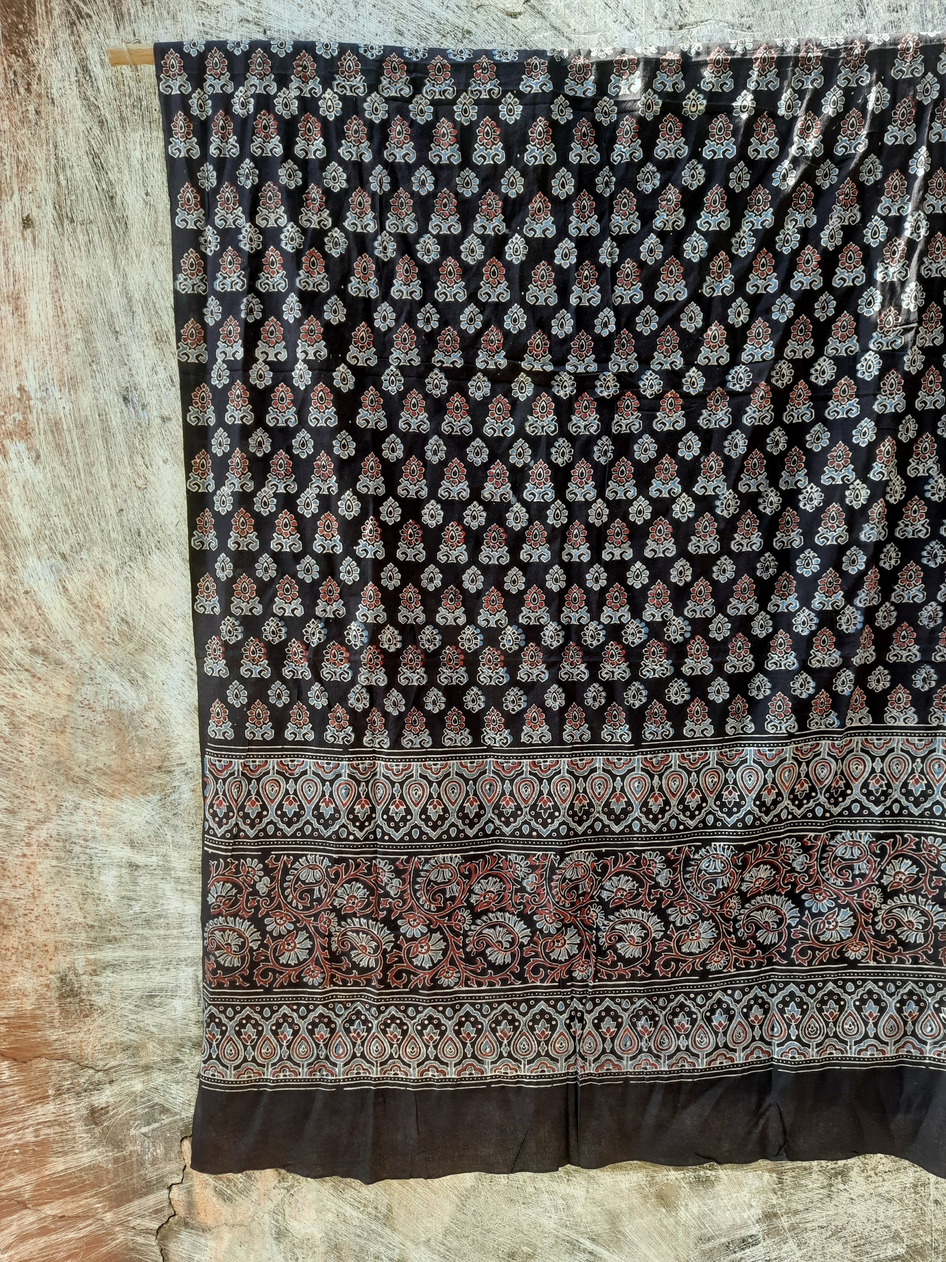 Natural dyed black dupatta in pure cotton featuring intricate Ajrakh hand block printed borders. Ethically handcrafted, lightweight, and eco-friendly, this elegant dupatta adds a timeless touch to ethnic and modern outfits, perfect for conscious fashion lovers.