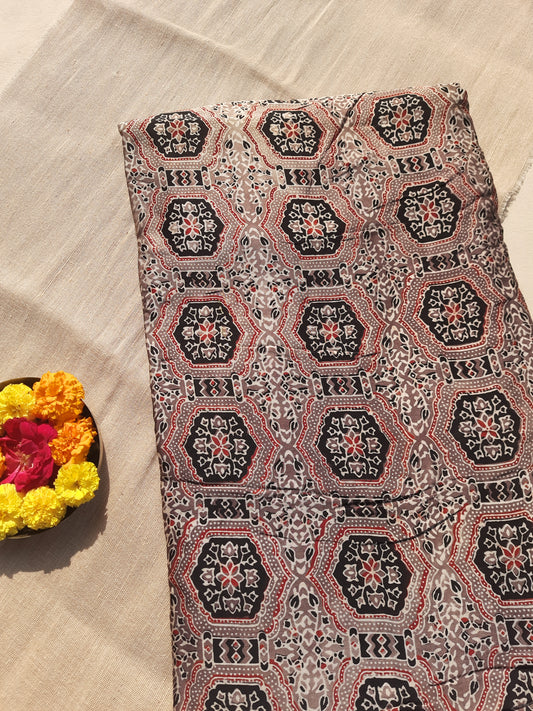 Earthy brown Ajrakh hand block printed modal silk fabric, 46-inch wide, naturally dyed, handcrafted by artisans. Luxurious, eco-friendly yardage perfect for elegant garments, accessories, and sustainable craft projects. Authentic and slow-made craftsmanship.