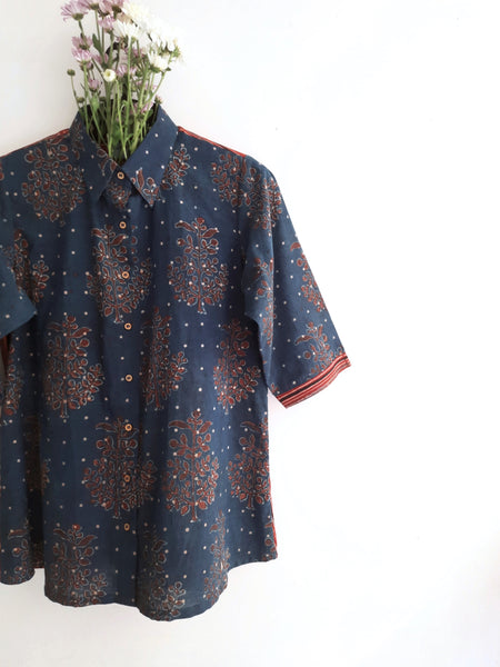 Image: Indigo and madder-dyed Ajrakh hand block print shirt for women, featuring intricate designs perfect for boho and classy summer looks. Breathable fabric ensures comfort for any outing. Shop now at Turquoisethestore.