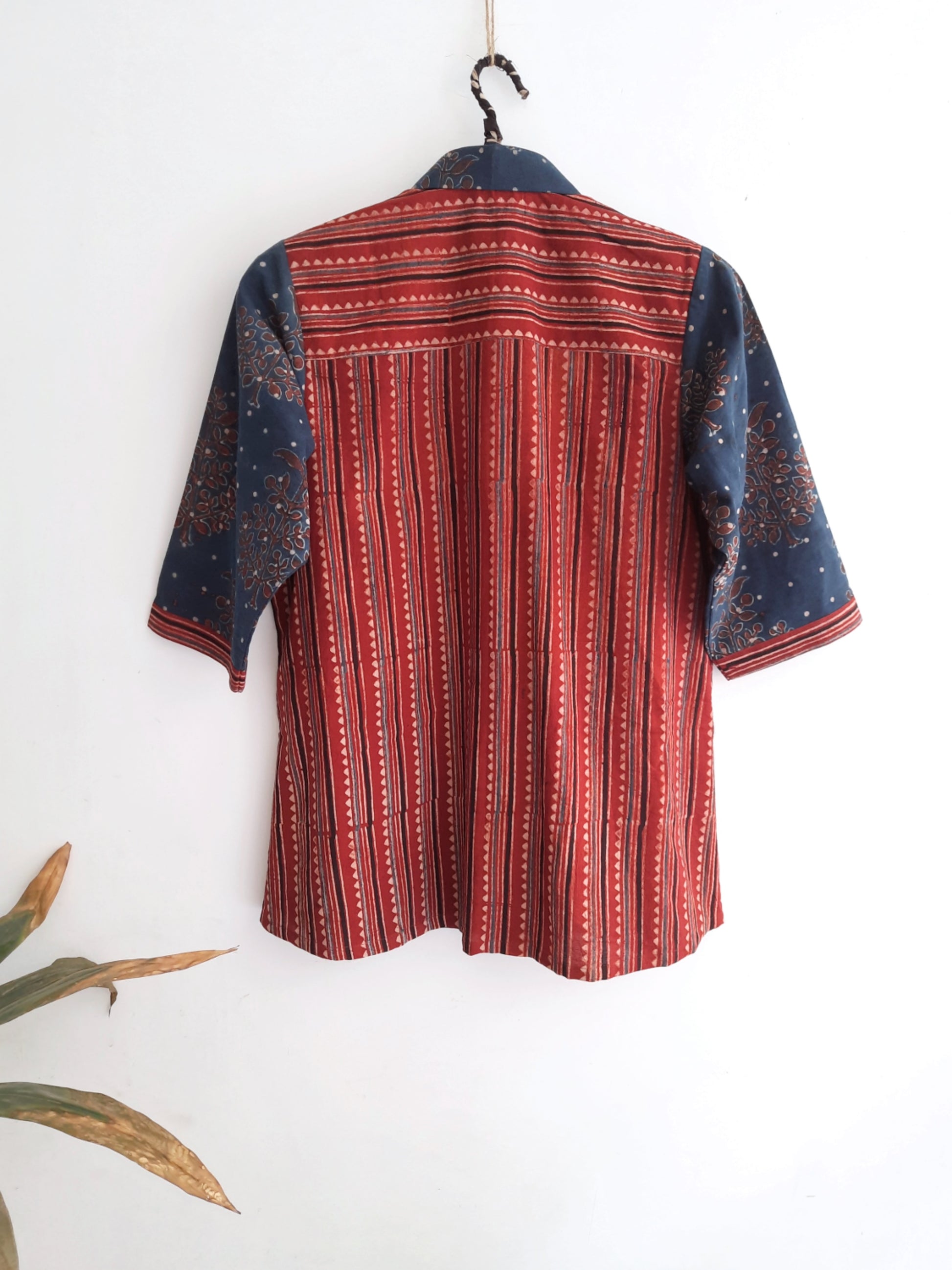 Image: Indigo and madder-dyed Ajrakh hand block print shirt for women, featuring intricate designs perfect for boho and classy summer looks. Breathable fabric ensures comfort for any outing. Shop now at Turquoisethestore.