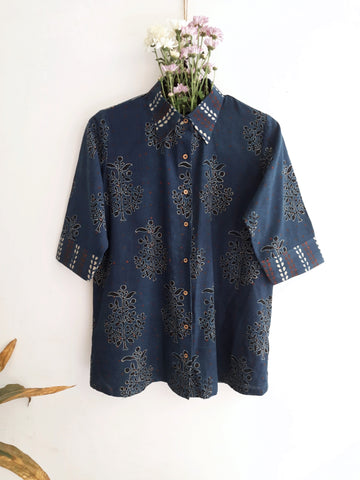 Image: Breezy Indigo Ajrakh Fusion shirt for women, featuring hand block prints in polkas, bootas, and stripes. Crafted with care, this indigo dyed shirt adds artisanal charm to any wardrobe. Shop now at Turquoisethestore.