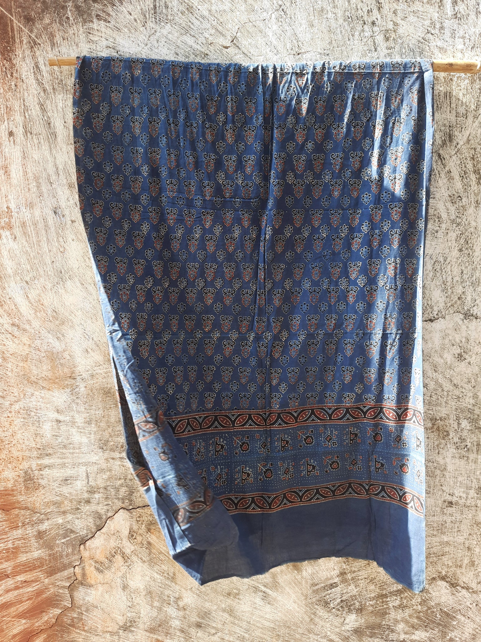 Handcrafted Indigo Dyed Ajrakh Cotton Dupatta with natural dyes and hand block printed borders. Ethically crafted, this eco-friendly, comfortable dupatta is perfect for adding a traditional, artisanal touch to your outfit. Ideal for cotton lovers and sustainable fashion enthusiasts.