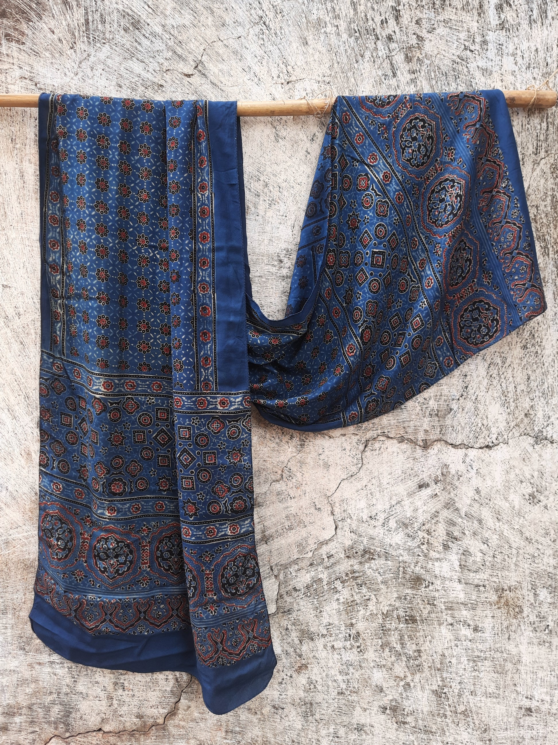 Indigo Ajrakh hand block printed modal silk stole for women, handcrafted with natural dyes, luxurious texture, and sustainable elegance. Perfect for any outfit.