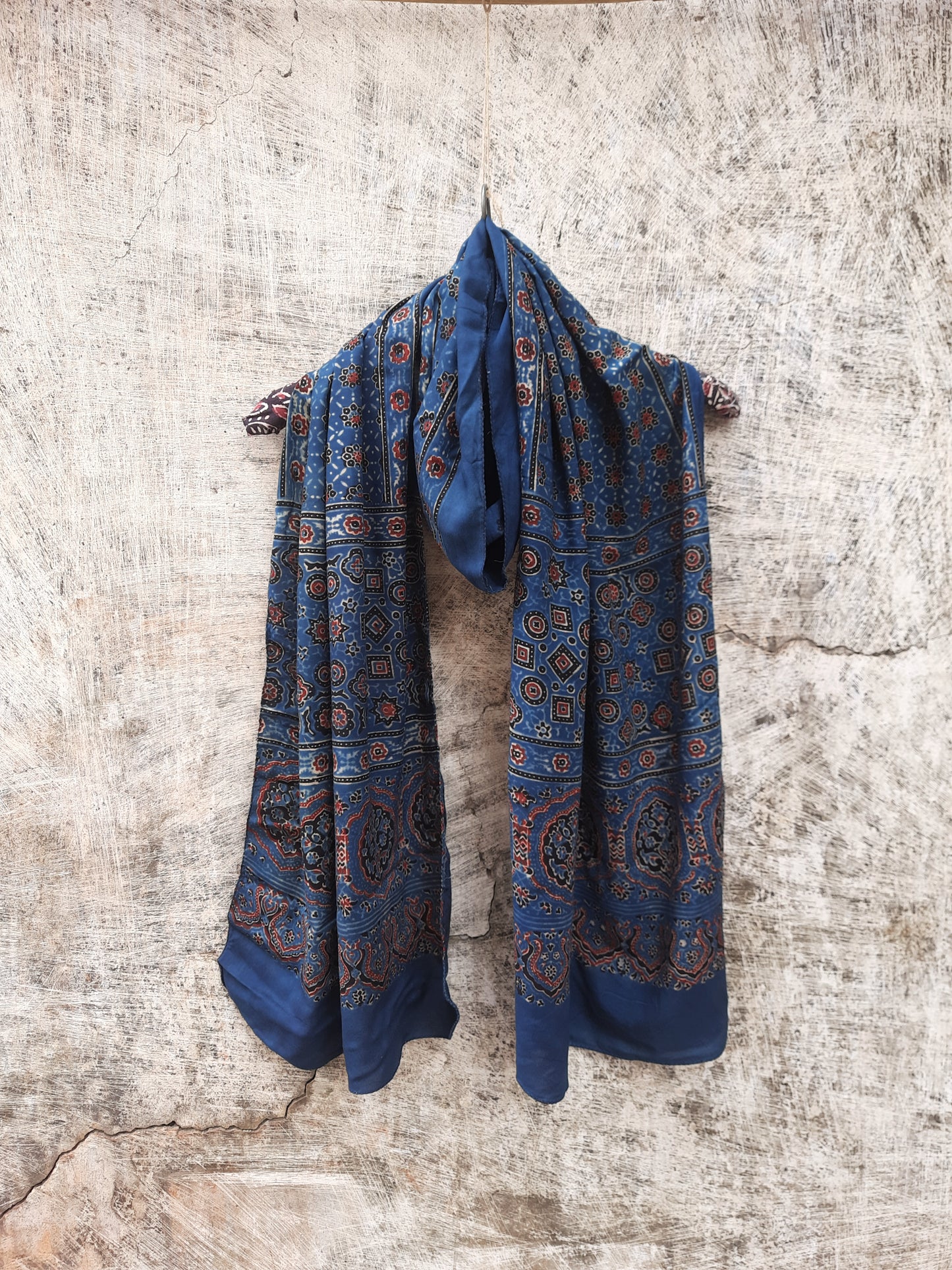 Indigo Ajrakh hand block printed modal silk stole for women, handcrafted with natural dyes, luxurious texture, and sustainable elegance. Perfect for any outfit.