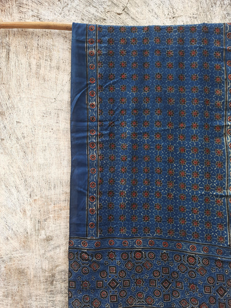 Indigo Ajrakh hand block printed modal silk stole for women, handcrafted with natural dyes, luxurious texture, and sustainable elegance. Perfect for any outfit.