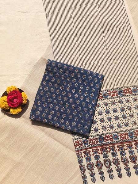 Ajrakh hand block printed two-piece suit set in pure cotton, featuring indigo small booti print and Myrobalan-dyed dupatta with traditional motifs. Eco-friendly, naturally dyed, and handcrafted ethnic wear.