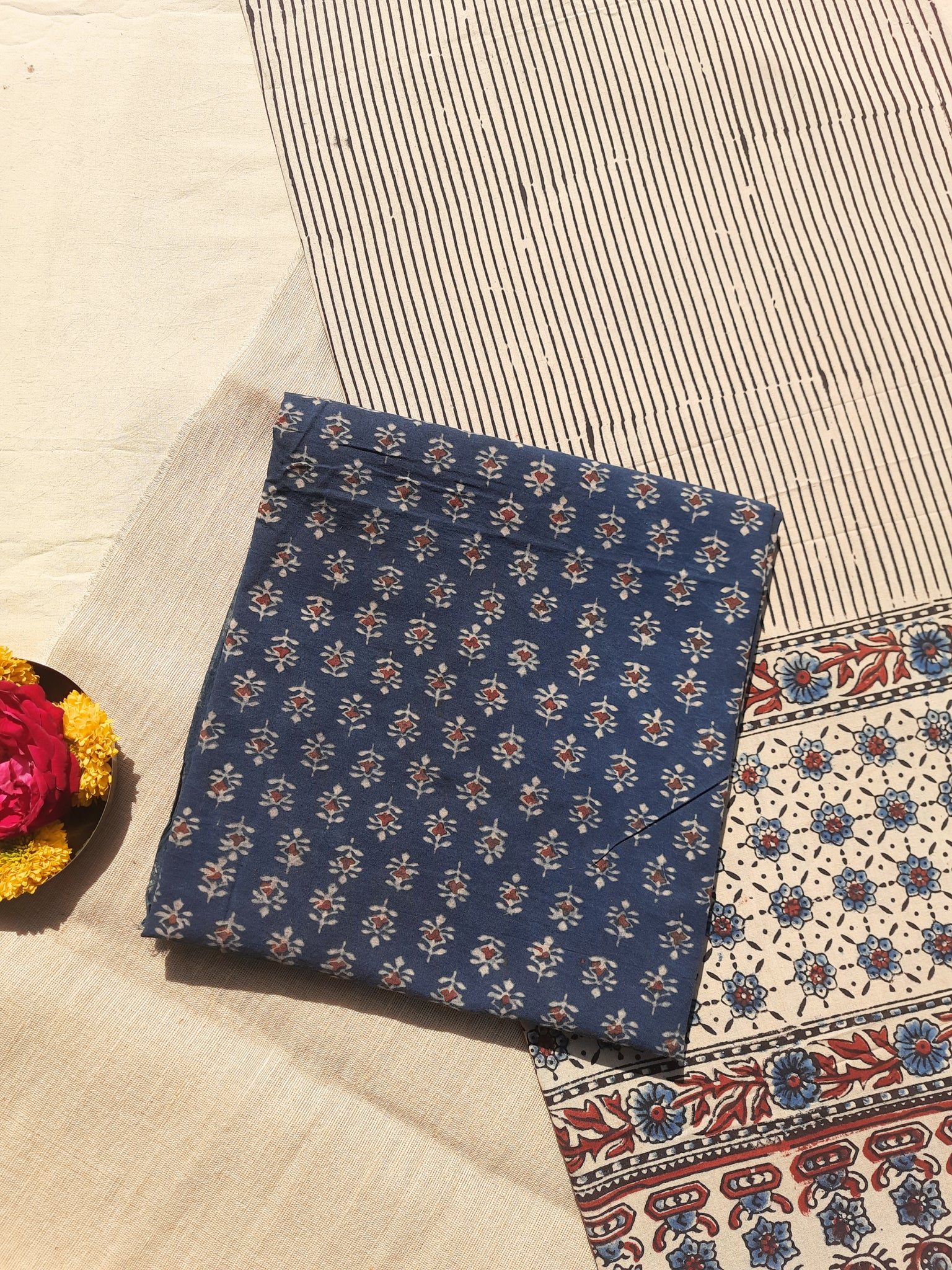 Ajrakh hand block printed two-piece suit set in pure cotton, featuring indigo small booti print and Myrobalan-dyed dupatta with traditional motifs. Eco-friendly, naturally dyed, and handcrafted ethnic wear.