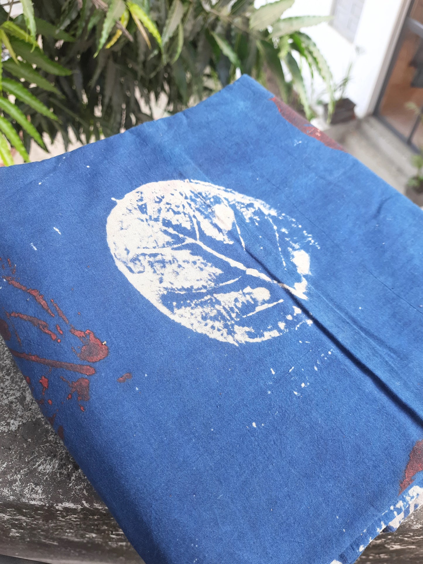 Indigo eco-printed cotton fabric, 44-inch wide, natural dye, sustainable pure cotton yardage for eco-friendly garments, crafts, and conscious creations.