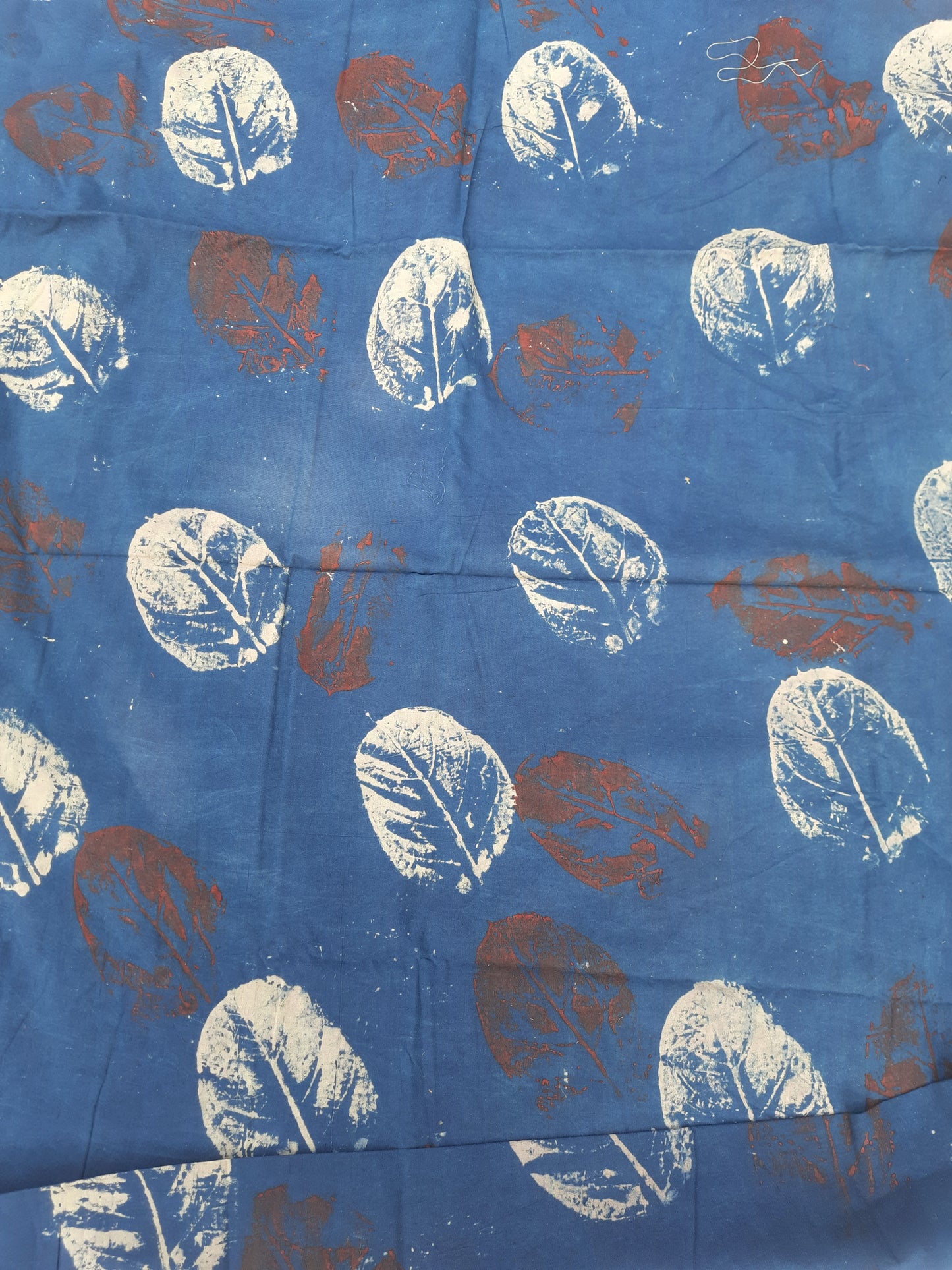 Indigo eco-printed cotton fabric, 44-inch wide, natural dye, sustainable pure cotton yardage for eco-friendly garments, crafts, and conscious creations.