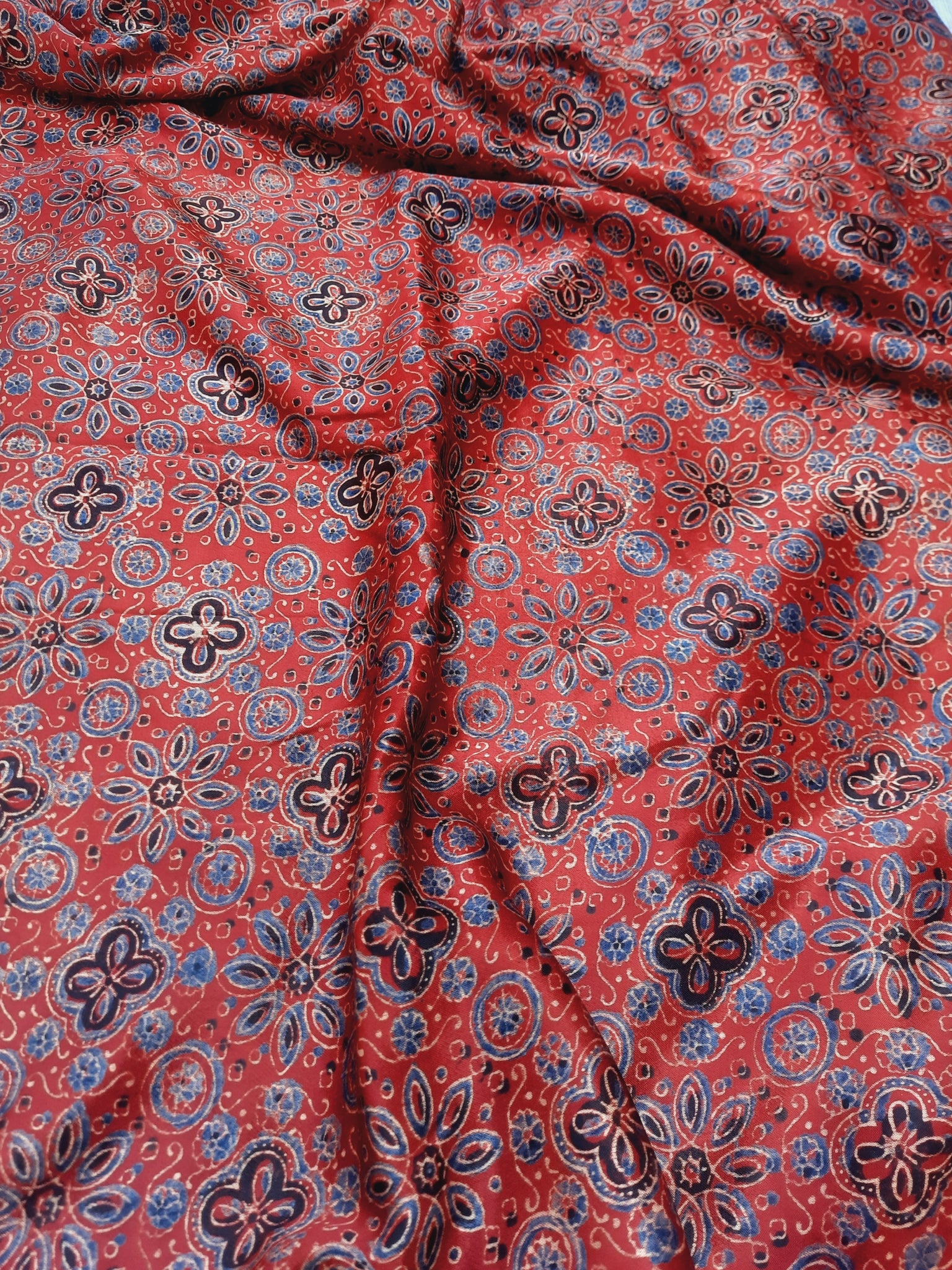 Madder red ajrakh hand block print mashru silk fabric.