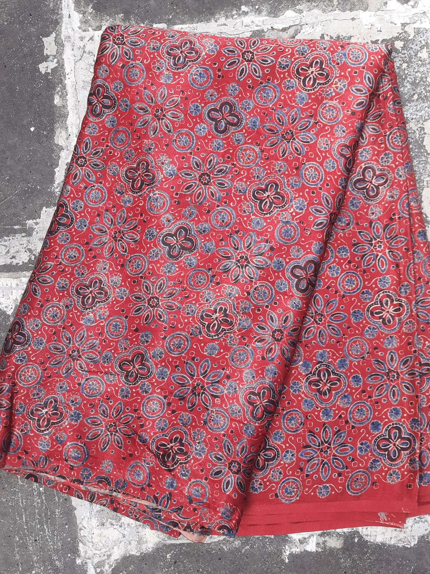 Madder red ajrakh hand block print mashru silk fabric.