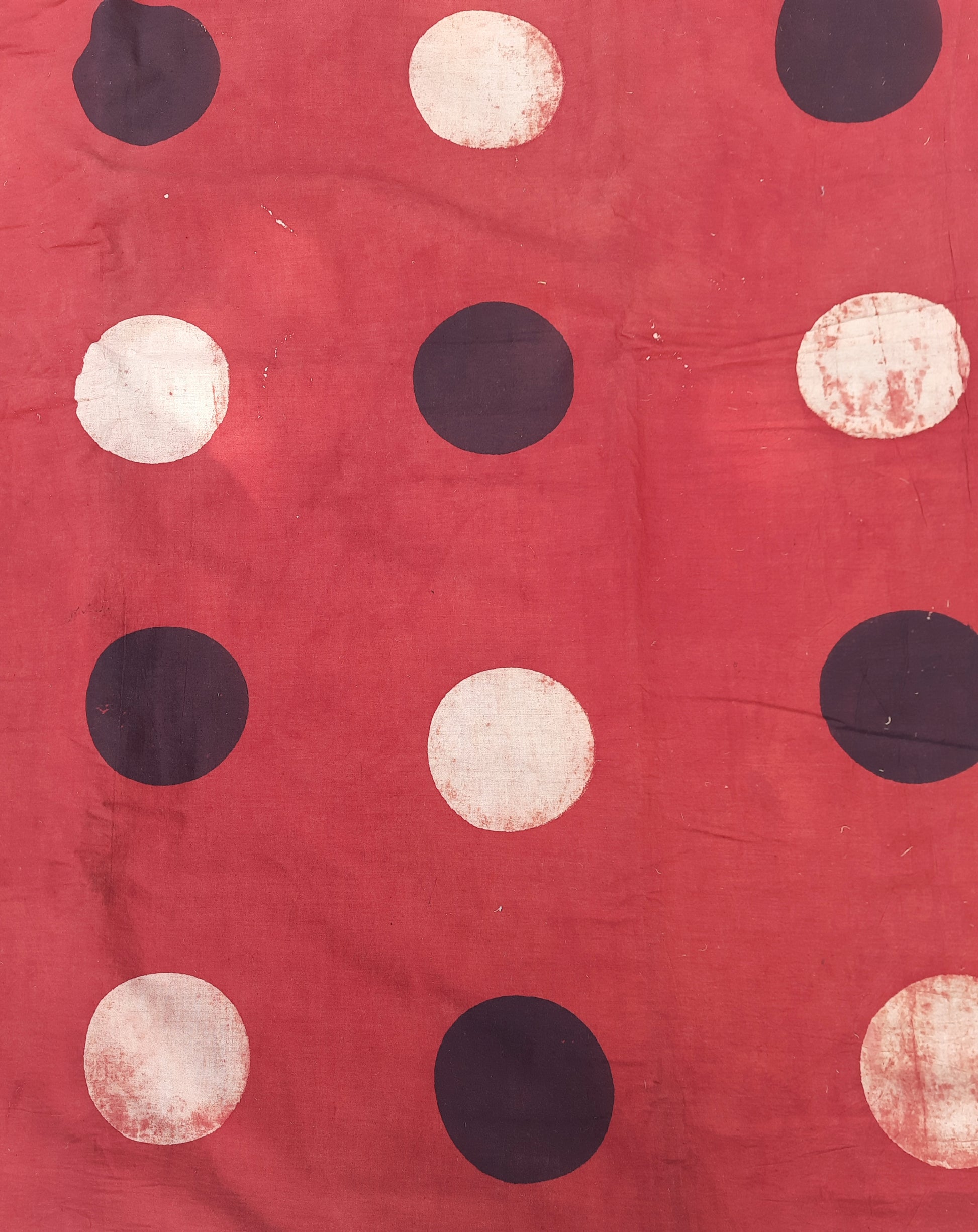 Madder-dyed Ajrakh hand block printed polka dot cotton fabric, 44-inch wide, naturally dyed, handmade, sustainable yardage for eco-friendly garments and crafts.