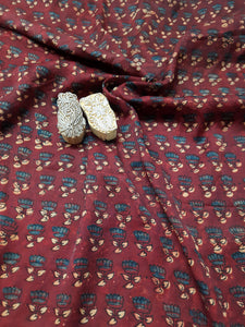 Madder-Dyed Maroon Ajrakh Hand Block Printed Modal Silk Fabric. This fabric is expertly crafted using traditional techniques of ajrakh hand block printing and natural dyeing. With its rich madder dye and artisanal quality, this fabric is sure to elevate your wardrobe and create a statement of elegance and sophistication.