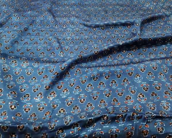 Wrap yourself in luxury with our Modal Silk fabric. Handcrafted using the traditional Ajrakh block printing technique and dyed with rich indigo, this fabric is not only ethically made but also adds an elegant touch to your eco-conscious wardrobe. 