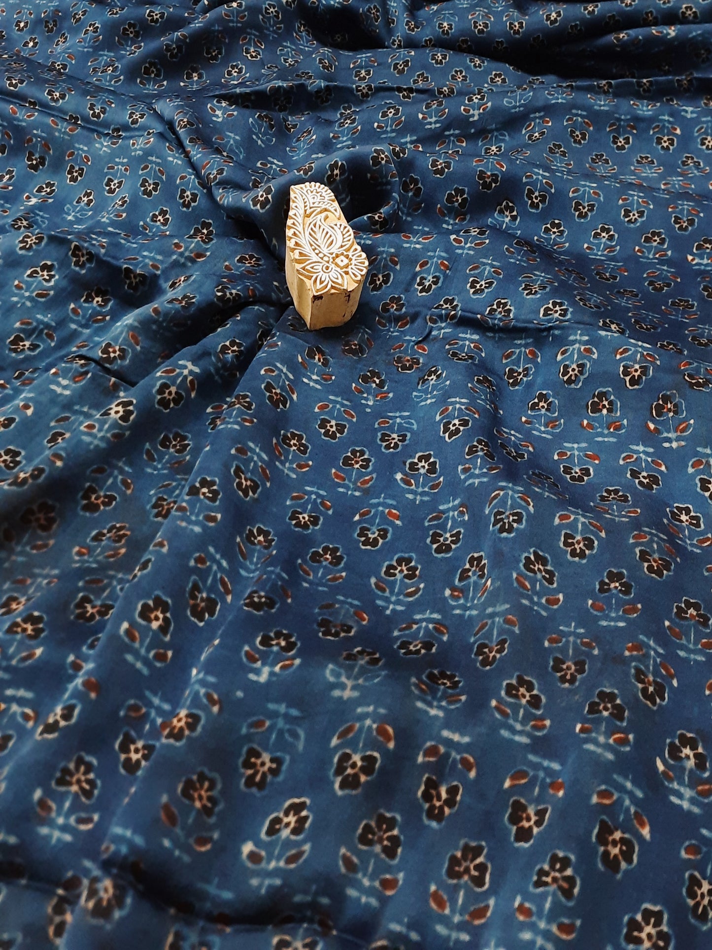Wrap yourself in luxury with our Modal Silk fabric. Handcrafted using the traditional Ajrakh block printing technique and dyed with rich indigo, this fabric is not only ethically made but also adds an elegant touch to your eco-conscious wardrobe. 