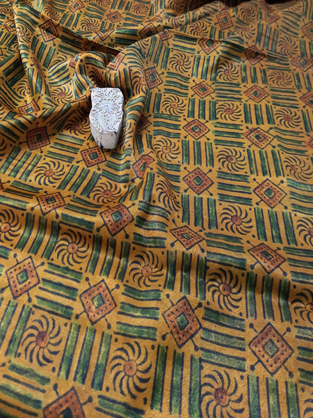 Mashru silk ajrak fabric, hand block printed with the intricate ajrakh design. The unique turmeric dye makes this fabric even more special, while supporting eco-friendly fashion. Elevate your wardrobe with this artisan-crafted  fabric.