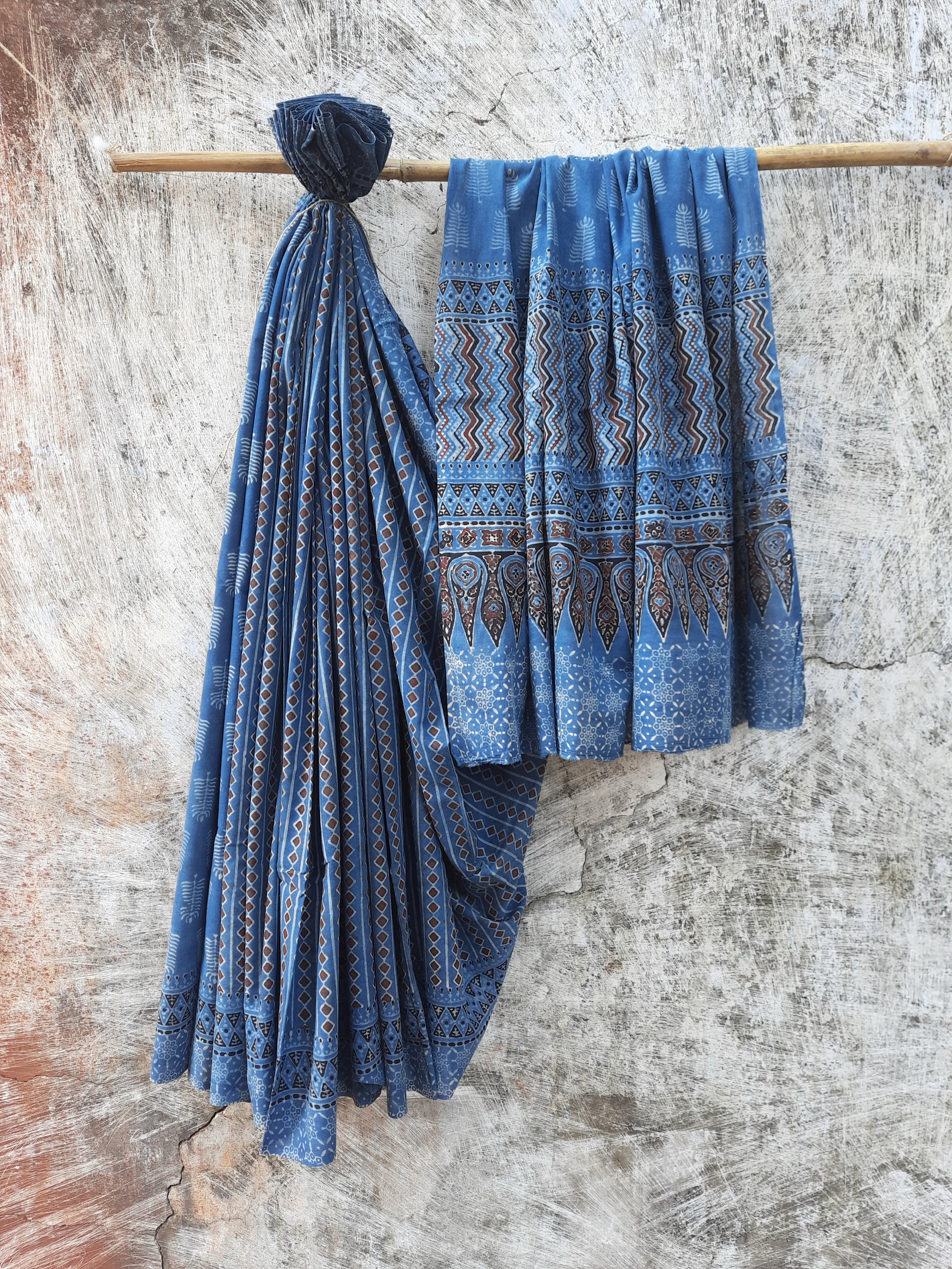 Ajrakh hand block printed indigo cotton saree, naturally dyed, pure cotton, featuring intricate traditional patterns, handcrafted with care for sustainable fashion.