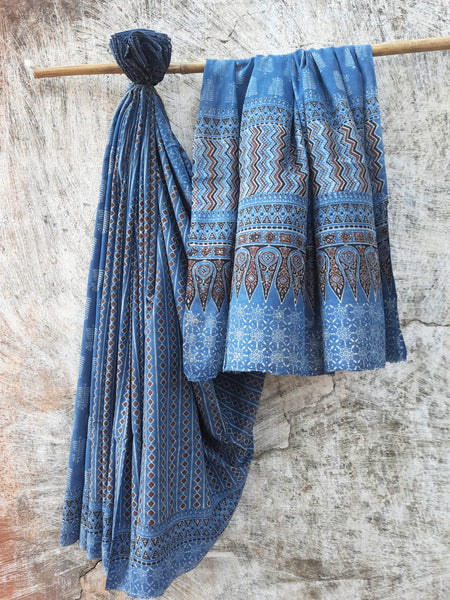 Ajrakh hand block printed indigo cotton saree, naturally dyed, pure cotton, featuring intricate traditional patterns, handcrafted with care for sustainable fashion.