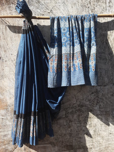 Indigo Ajrakh hand block printed saree in pure cotton, naturally dyed and ethically crafted in India, featuring breathable fabric for sustainable fashion.