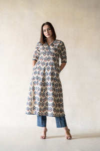 Sustainable Fashion - Look beautiful in this Mogra Indigo Ensemble, a luxurious pairing of a traditional block-printed kurta and modern-style stripe pants. Featuring an A-line silhouette, kali cut, and a striking neckline, this eco wardrobe option is both comfortable and classy. Paired with natural indigo dye and an elasticated waistband pants you will have a timelessly elegant look.