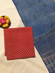 Handcrafted Ajrakh suit set in pure cotton with madder-dyed polka dots and an indigo-striped dupatta. Naturally dyed, breathable, and slow-made, showcasing intricate hand block printing. Perfect for Indian ethnic wear and sustainable fashion lovers.