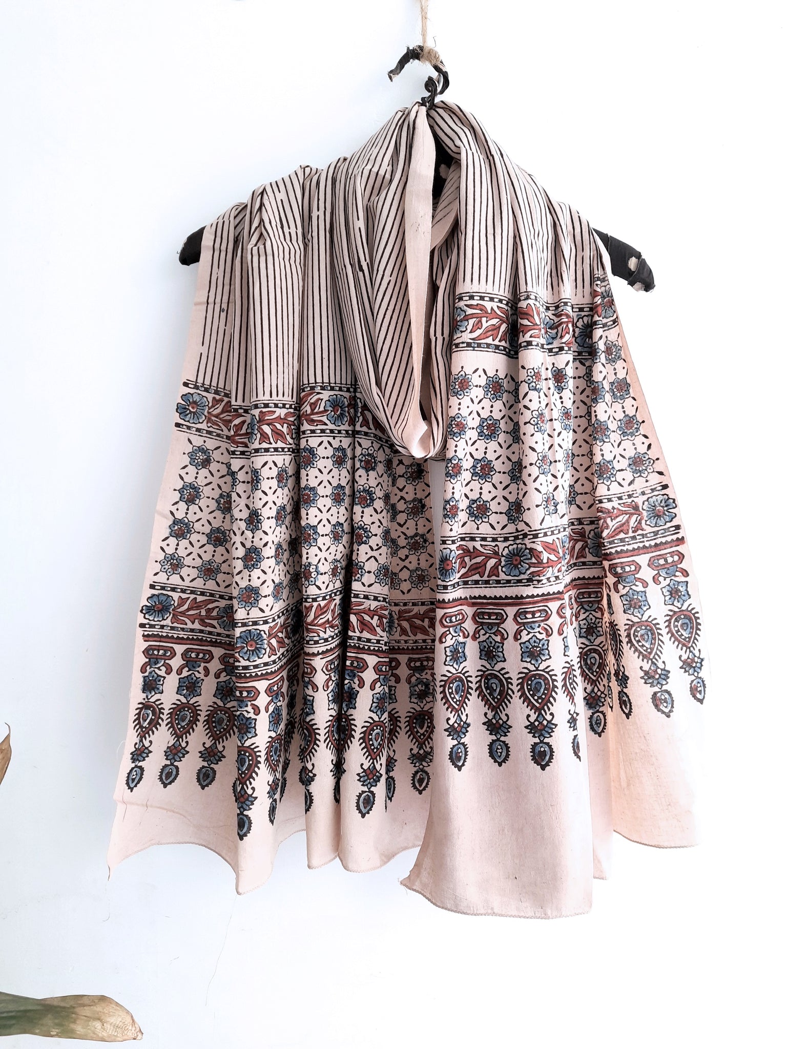 Turquoisethestore's Beige Stripes Ajrakh Cotton Dupatta, handcrafted with 100% pure cotton using traditional ajrakh methods and myrobalan dyed. Elevate your summer fashion with this eco-friendly, artisanal accessory, adding a timeless touch to any ensemble.