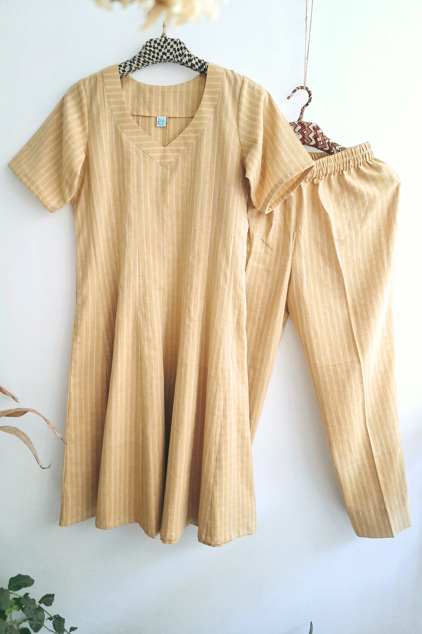 Women's summer coord set crafted from hand-spun and woven cotton, featuring delicate stripes for a breezy, stylish look.