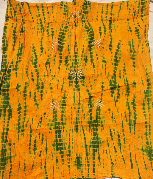 Handcrafted Shibori & Rai Dani Bandhani cotton suit set in yellow and green. Traditional Indian tie-dye dress material, artisan-made in Gujarat. Unstitched three-piece suit set, crafted consciously from pure cotton. Perfect for custom ethnic wear, salwar suits, or fusion outfits. A unique blend of heritage craftsmanship and sustainable fashion, showcasing intricate patterns and vibrant colors.